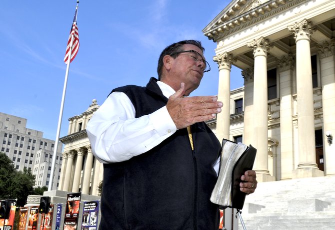 Preacher Flip Benham and his band of anti-abortion protesters from Operation Rescue America descended on Jackson Monday, two days after a pro-abortion rights rally at Jackson Women's Health Organization, or JWHO, the state's sole remaining abortion clinic.