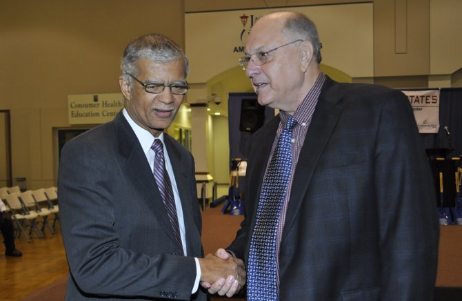 Jackson Mayor Chokwe Lumumba and Clarence Chapman, president of Chartre Consulting Ltd., helped break ground on a downtown housing development that Lumumba called part of an intelligent urban renewal plan.