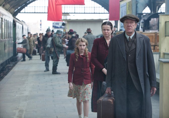 Liesel (Sophie Nélisse) finds a new home in wartime with Rosa (Emily Watson) and Hans (Geoffrey Rush).
