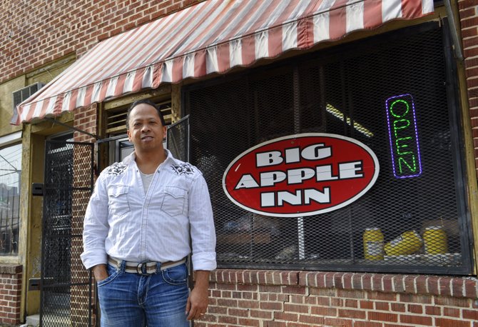 Geno Lee is the fourth generation of his family to sling pig-ear sandwiches at the Big Apple Inn.