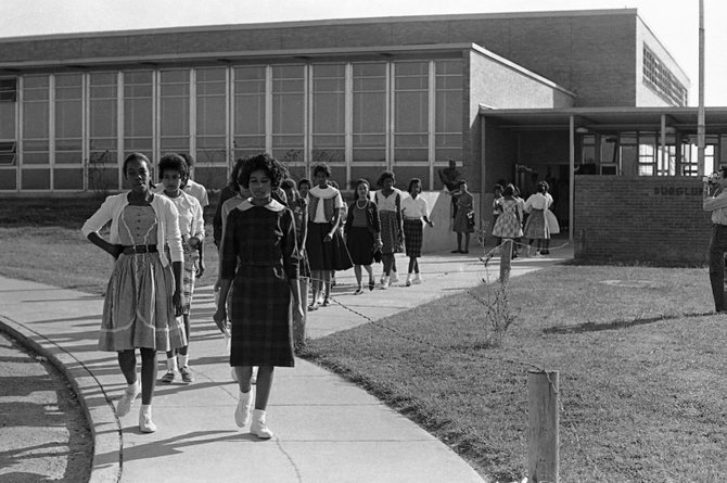 Burglund students walk out of their school in McComb, Miss., in 1961. (Associated Press)