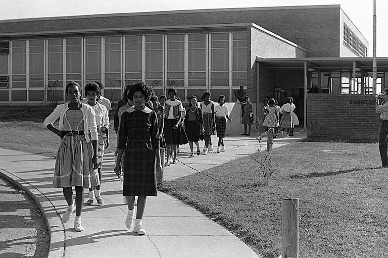 Burglund students walk out of their school in McComb, Miss., in 1961. (Associated Press)