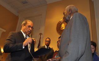 After the death of Mayor Chokwe Lumumba, Judge Melvin Priester Sr. (left) swore in Council President Charles Tillman as acting mayor of Jackson. Melvin Priester Jr. (center) became council president, and Councilwoman Margaret Barrett-Simon (far right) looks on.