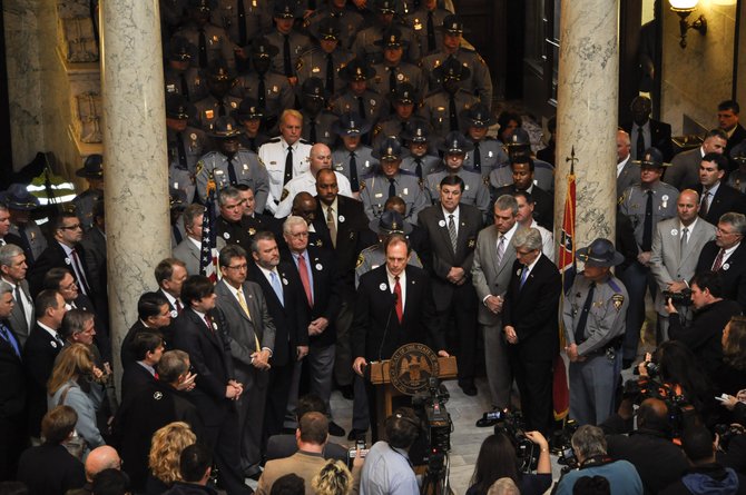 More than 100 uniformed, off-duty troopers went to the Capitol on Wednesday to rally for their requests.