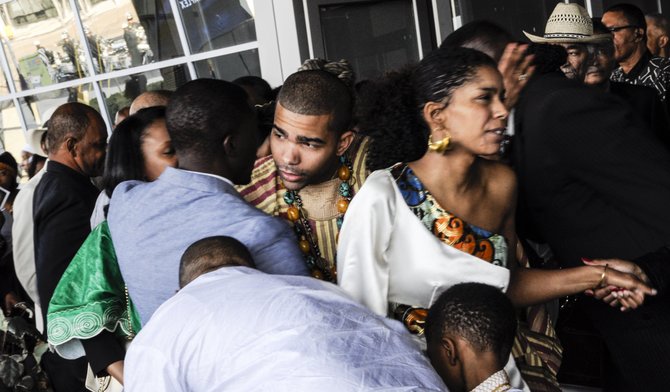 Chokwe Antar Lumumba (left) and Rukia Lumumba (right) greet people at their father's funeral.