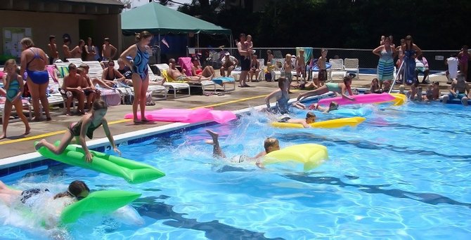 Faced with losing a popular local swim club, Friends of Briarwood Pool have raised $15,000 to keep the YMCA pool and Briarwood Dolphins swim team afloat.