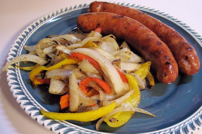 Cooking sausage in liquid that’s part beer deepens the flavors and makes for a perfect food-drink pairing.