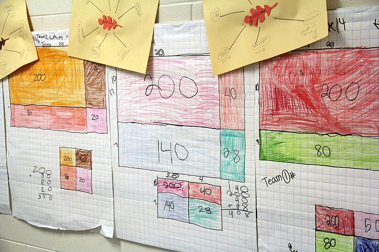Student work in the hallway of a Mississippi elementary school shows the “partial product” method of solving a multiplication problem. The new Common Core standards emphasize multiple ways of solving problems.