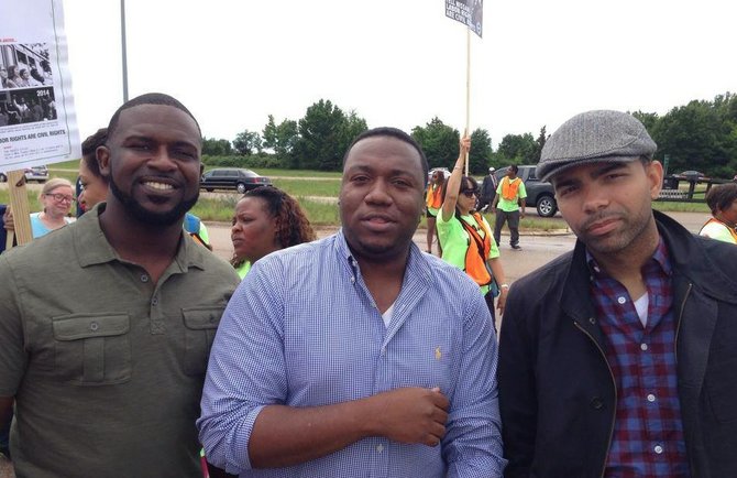 Tyson Jackson, C.J. Lawrence and Chokwe Antar Lumumba stand together at a Lumumba campaign event.