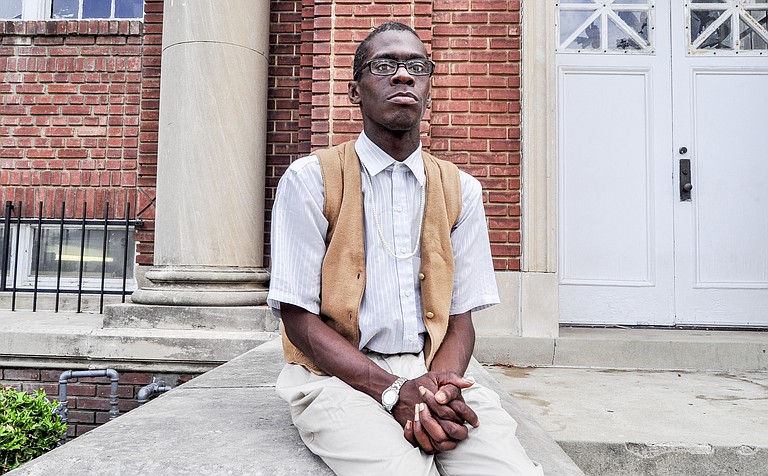 Timothy Randall Lewis, Jr. waits outside of Stewpot on West Capitol street. He hopes to get a meal to eat.