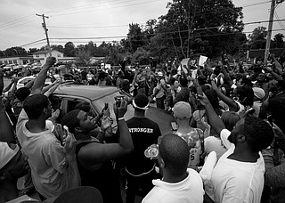 People protesting the Ferguson, Missouri, grand jury decision took to the streets in cities across the U.S. for a second day Tuesday, showing that the racially charged case has inflamed tensions thousands of miles from the predominantly black St. Louis suburb.