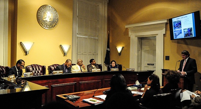 Mark Inbody of Siemens and Mitch King (pictured speaking at podium) with sub-contractor Garrett Enterprises ECI—the firm founded by businessman Socrates Garrett, who is now retired—fielded questions from the council. The representatives said that so far, 27,238 residential and 778 commercial meters have been installed.