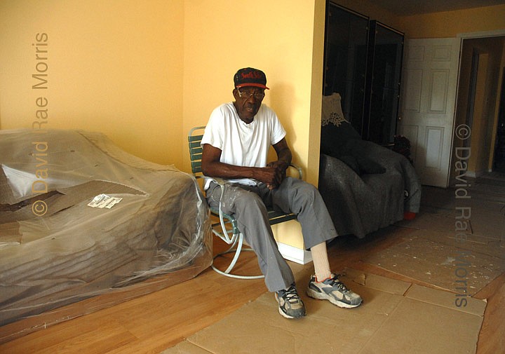 Herbert Gettridge, then 83, sits in the front room of his house on North Roman Street in the Lower 9th Ward of New Orleans, Louisiana June 1, 2007, the first day of the Atlantic hurricane season. Gettridge evacuated New Orleans prior to Hurricane Katrina, but his house, which he built himself in the early 1950s, took on more than 10 feet of water. Photo courtesy David Rae Morris