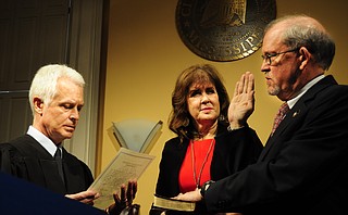 Ashby Foote (right) with his wife, Suzie Foote (center), taking the oath from Hinds County Chancery Judge Bill Singletary (left).