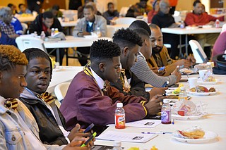 On a recent Saturday at Cade Chapel Missionary Baptist Church, young men met with with local law-enforcement officials about how to best interact with police. Photo courtesy Darek Ashley