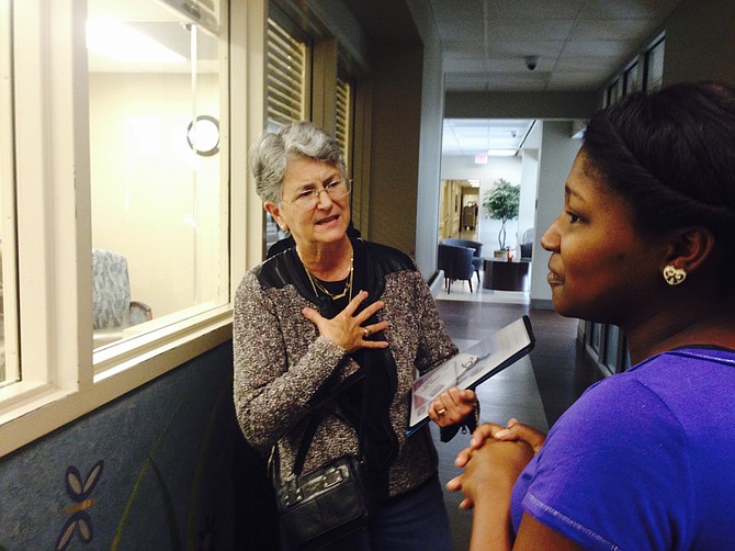 Certified Lactation Consultant Linda McGrath (left) encourages Frankie Maxwell (right) to breastfeed her twins outside the nursery of the OCH Regional Medical Center in Starkville. Photo courtesy Sharon Lerner