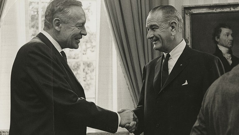 Fifty years ago this this month President Johnson's science advisors delivered the first warning about rising greenhouse gas emissions to a sitting president. On Feb. 8, he warned Congress about altering the atmosphere with carbon emissions. Climate scientist Roger Revelle (left) shakes hands with Johnson (right) in the Oval Office. Photo courtesy Roger Revelle Papers, Special Collections & Archives, University of California, San Diego