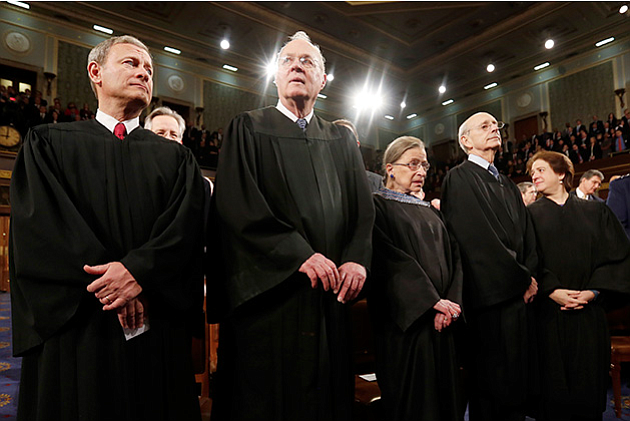 The Supreme Court is assessing Oklahoma's use of a sedative used in its three-drug lethal injection protocol. Above, Chief Justice John Roberts, left, stands with fellow Justices Anthony Kennedy, Ruth Bader Ginsburg, Stephen Breyer and Elena Kagan before President Obama's State of the Union speech in January 2014. Photo courtesy Larry Downing/Pool/Getty Images