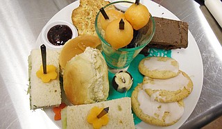 High Biscuits offers house-made chicken salad or chopped salad, two kinds of soup, plain cream scones and southern tea cakes on a daily basis. Other food selections change on a daily basis, including a variety of sandwiches, pastries, savory tarts and quiches. Photo courtesy High Biscuits Tea