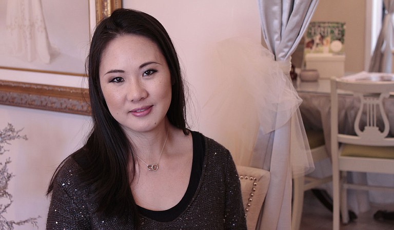 Samantha Woo of Woo Couture loves custom designing wedding dresses for her brides. Photo courtesy Amber Helsel