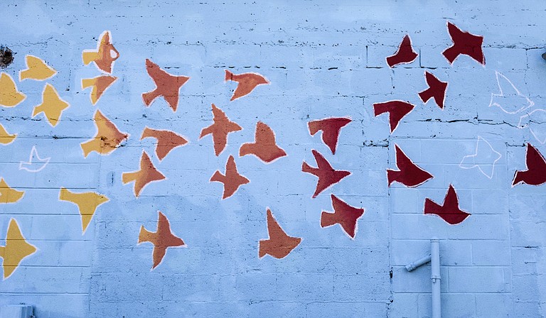 Margaret Sullivan designed the mural outside of Stewpot Community Service’s Opportunity Center.