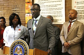 Mayor Tony Yarber (center) this morning credited his wife, Rosalind (left), who works for the Salvation Army, with coming up with the goal of ending homelessness among veterans by the end of the year. Also pictured is Marshand Crisler (right), deputy chief administrative officer for the City of Jackson.