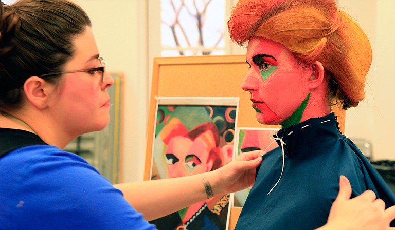 Mississippi Museum of Art’s Visitor and Member Services Coordinator Emily Summerlin styles the museum’s graphic designer Amanda Lucius after a 1943 Dusti Bongé painting titled “The Balcony.” The work is in the Mississippi Museum of Art’s permanent collection and is one of many pieces that will come to life during the spring benefit, “Night at the Museum: Artworks Come Alive.” Photo courtesy Mississippi Museum of Art, gift to MMA from the Dusti Bongé Foundation