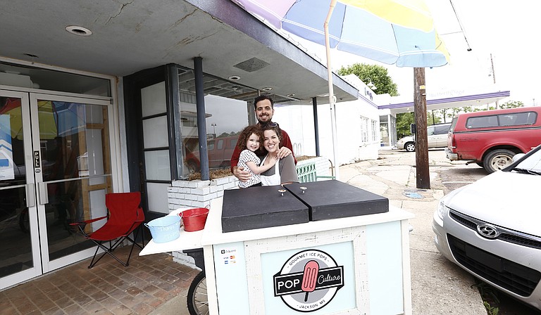 Most days, you can find Pop Culture Ice Pops, which Craig Kinsley (top center) owns with his wife, Lori Kinsley (bottom right with daughter, Piper), in front of the Capri Theatre in Fondren.