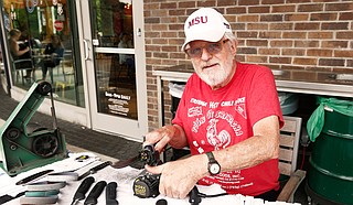 Jim Burwell, who owns Burwell Blades, has set up many Saturdays outside of Whole Foods Market to sharpen blades for people.