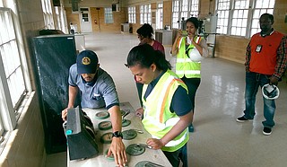 Kishia Powell learns how to clean filters at the city’s 100-year-old J.H. Fewell Water Treatment Plant from Terrance Byrd, the plant’s operations manager. Later that day, she also helped repair a broken sewer line, resurface a street, mop floors and process water payments, all tasks that fall under her direction as public-works director.