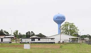 An inmate "made direct contact" with two detention officers at the Hinds County Detention Center at Raymond, Hinds County sheriff's department spokesman Othor Cain said, and they were taken to a hospital with nonlife-threatening injuries.