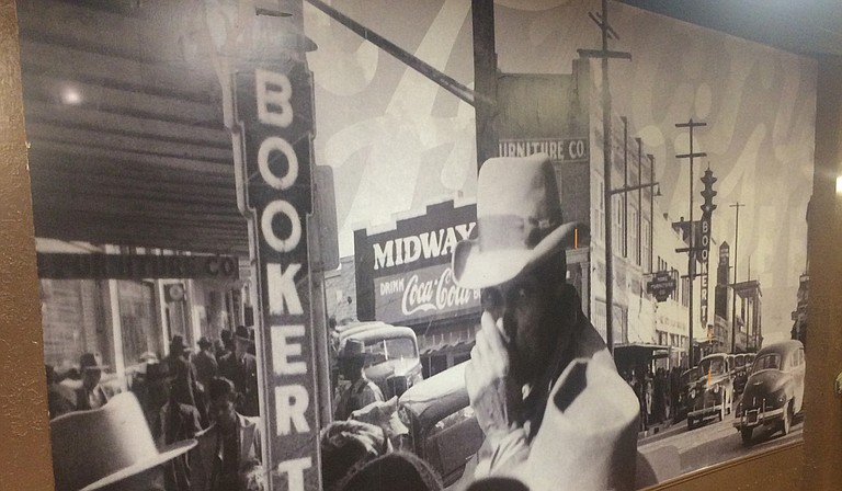 A mural on the wall of Johnny T's Bistro and Blues is made up of photographs of Farish Street in its prime. Photo courtesy John Tierre