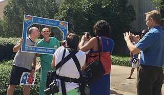 Scott (left) and Jason (right) Crutchfield-Rogers pose outside the Hinds County Courthouse, following the U.S. Supreme Court's historical ruling on same-sex marriage. Photo courtesy Arielle Dreher