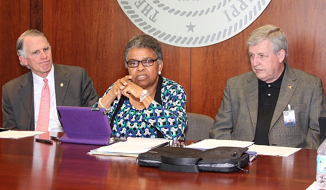 Constance Slaughter-Harvey, center, would have liked the committee to examine other aspects of the state's prison system. Also pictured are Andy Taggart (left) and Bill Crawford (right). Photo courtesy MDOC