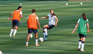 The U.S. Women’s National Team players, including Carli Lloyd (facing the camera), give young girls role models to look up to. Photo courtesy Flickr/Kkimphotography