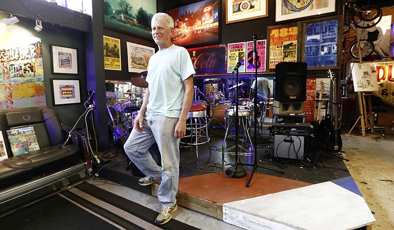 Mark Millet’s art studio in Ridgeland is adapted from an old car garage, which he says gives him the space to paint, work on cars and display his drum kit.