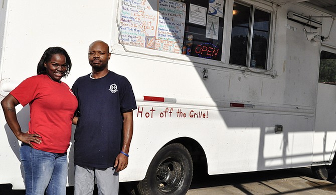 2 for 7 Kitchen owners Deandrea (left) and Omario Moore (right) have partnered with the Mississippi Museum of Art to let artists create a new design for the food truck’s exterior. Trip Burns/File Photo