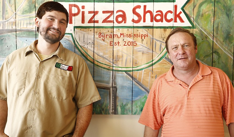 Ryan Patrick (left) and Michael Parker (right) opened the first location of The Pizza Shack in 2005.