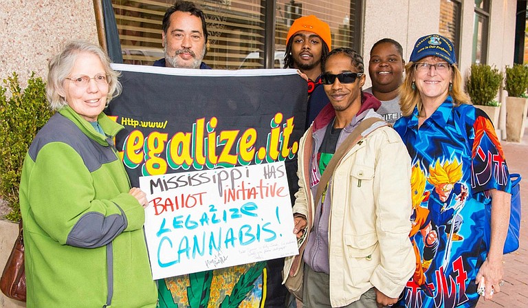 Kelly Jacobs (far right), one of the lead forces on Initiative 48 to legalize smoking and growing pot in Mississippi, fears organizers could miss the mark to put it on the 2016 ballot. Also pictured, from left to right, are: Susan Watkins, David Lions, Jamarcus Manning, Kassa Whitley and Shannon Smothers-Wansley. Photo courtesy Kelly Jacobs/File Photo