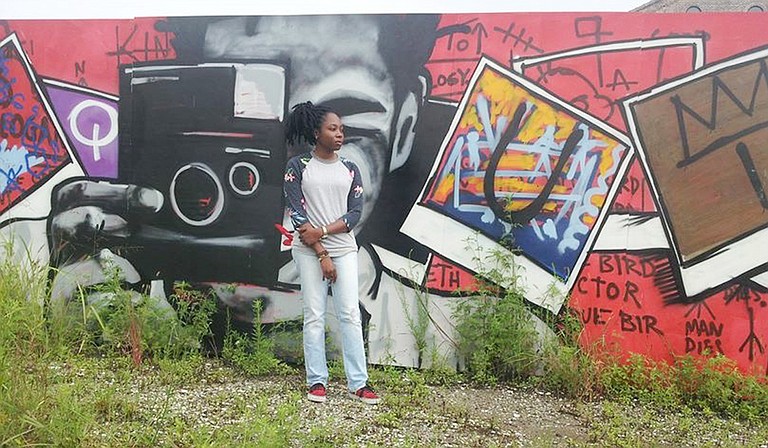 Jackson pop artist Adrienne Domnick (pictured in front of a mural in Bywater, New Orleans) often creates pieces that center on artists and musicians that she finds inspiring. Many of them are African Americans. Photo courtesy Mississippi Museum of Art