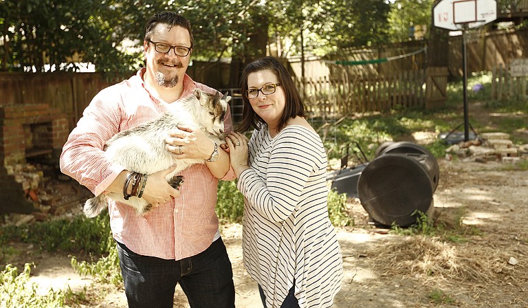 Chef Tom and wife Kitty Ramsey (left to right) with their pet goat Pat in Belhaven