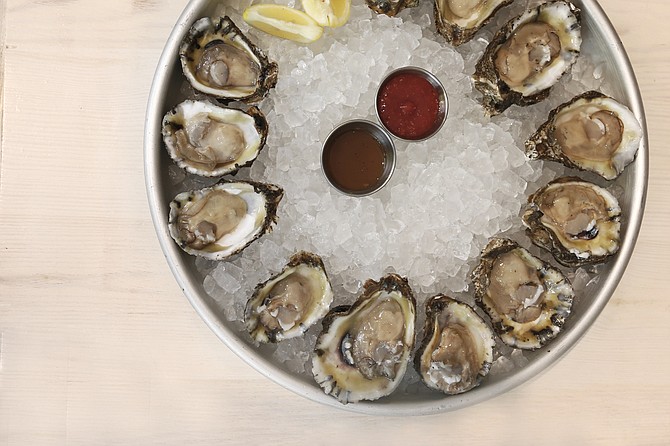 Half Shell Oyster House serves hand-shucked oysters raw, charbroiled, baked or broiled or on the half shell with a special blend of herbs and mushrooms or a spicy New Orleans-style buttery barbecue sauce to go with them.