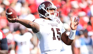 Mississippi State University quarterback Dak Prescott entered the Bulldogs game against Louisiana State University too late to turn it around. Photo courtesy MSU Athletics