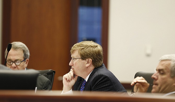Leaked emails claim that Lt. Gov. Tate Reeves (center) and Speaker Philip Gunn (right) are connected to an anti-42 PAC and raise questions about the legality of using taxpayer resources to campaign against a ballot initiative. Senate Pro Tem Giles Ward, R-Louisville, is on the left side of the photo.