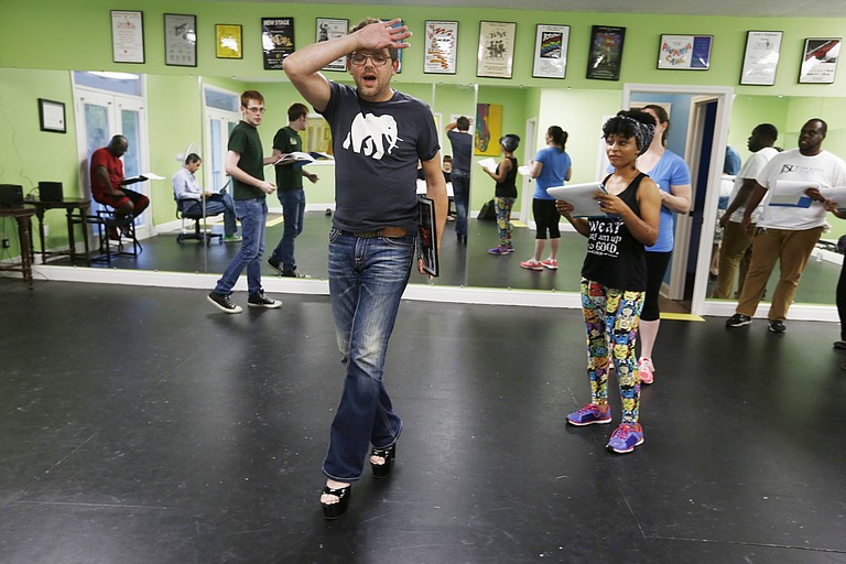 Chad King, who plays Frank N. Furter in Fondren Theatre Workshop’s production of “The Rocky Horror Show,” rehearses for the performance as other cast members look on.