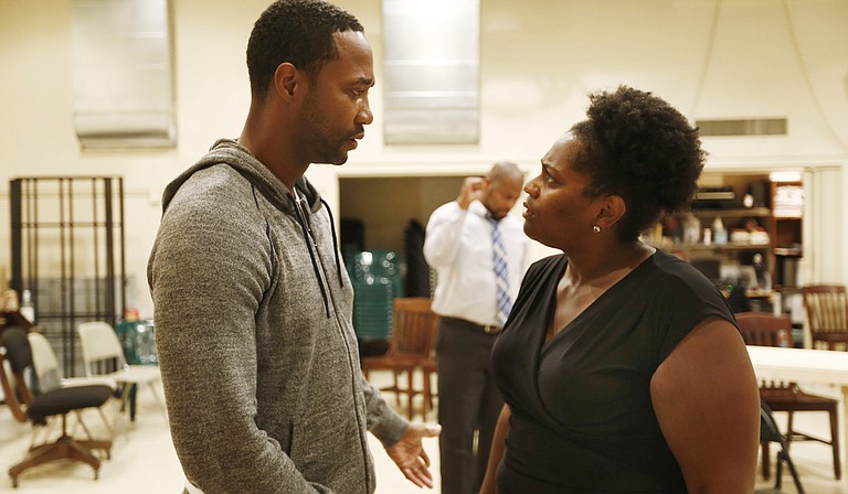 Yohance Myles (left) and Sharon Miles (right) play Carl Lee Hailey and Gwen Hailey, a couple whose family is thrown into turmoil after Carl Lee murders his daughter’s rapists and goes on trial in “A Time to Kill” at New Stage.