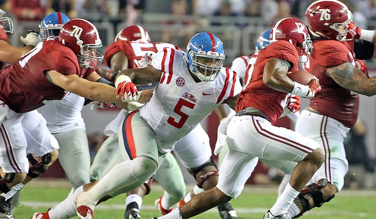 After suffering a concussion while playing offense during the University of Mississippi’s game against the University of Memphis, Rebels defensive tackle Robert Nkemdiche, who had been playing both sides of the ball, probably won’t be returning to offense. Photo courtesy University of Mississippi Athletics