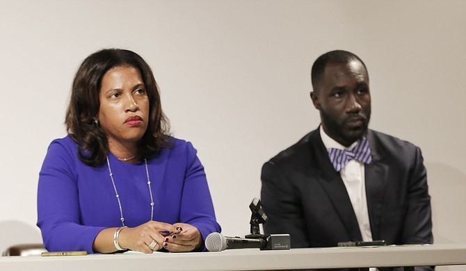 City of Jackson Public Works Director Kishia Powell (left) and Mayor Tony Yarber (right) answered questions from the public about exorbitant water bills at a town hall meeting on Nov. 16.