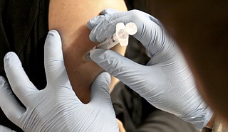 The Centers for Disease Control says an annual influenza vaccination is the best way to fight against getting or spreading the flu, which can be deadly. Photo courtesy Flickr/US Army Corp of Engineers 