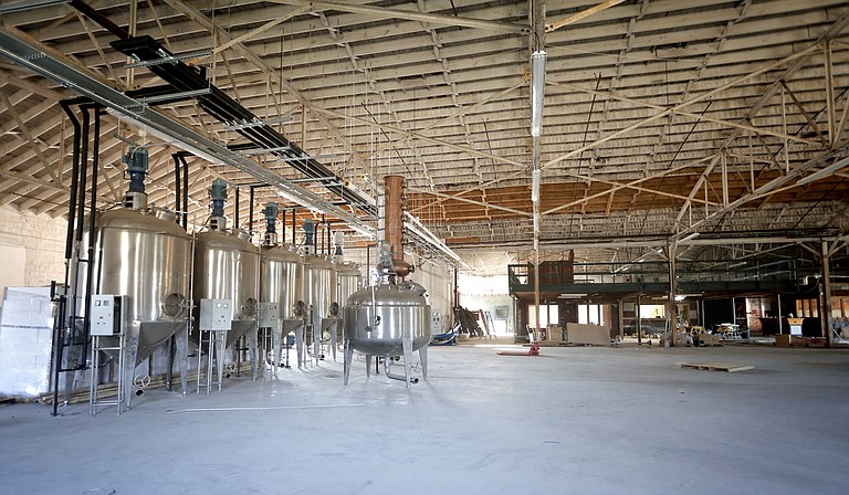 Cathead Distillery will host a grand opening for its new downtown  location on Dec. 12.